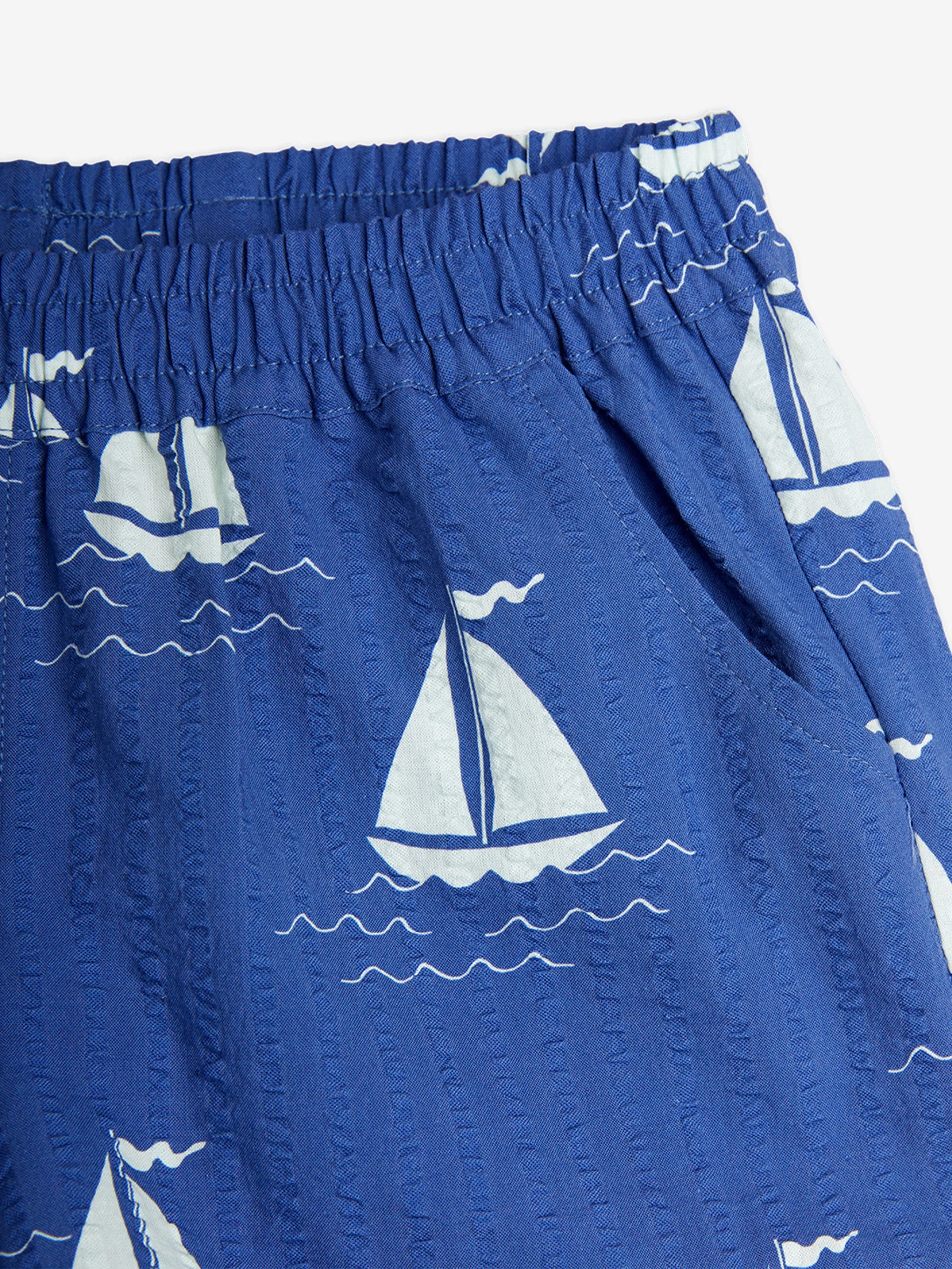 Mini Rodini Boys Sailing Boats AOP Shorts in Blue