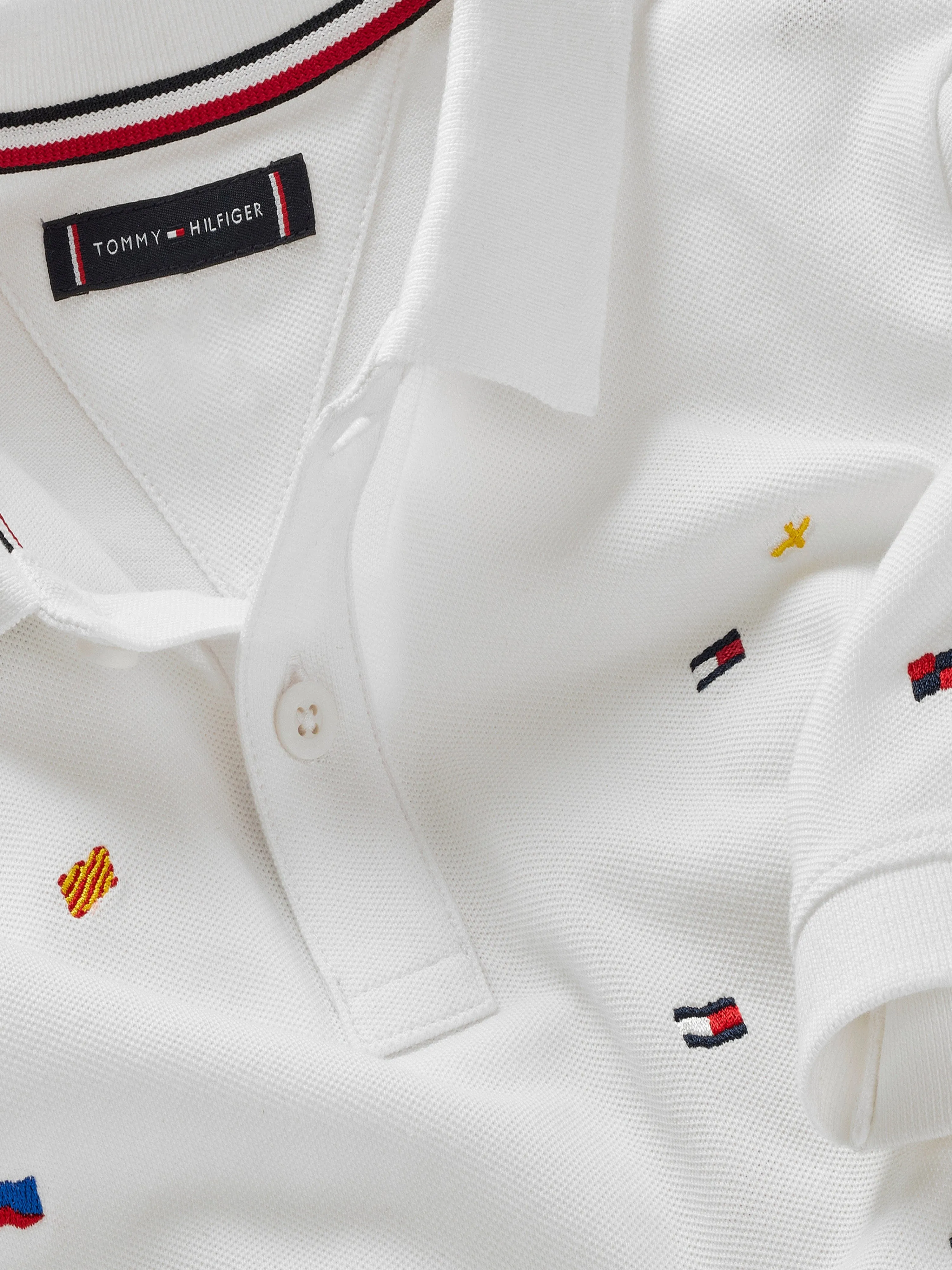Tommy Hilfiger Boys All Over Flag Embroidered Polo Shirt in White